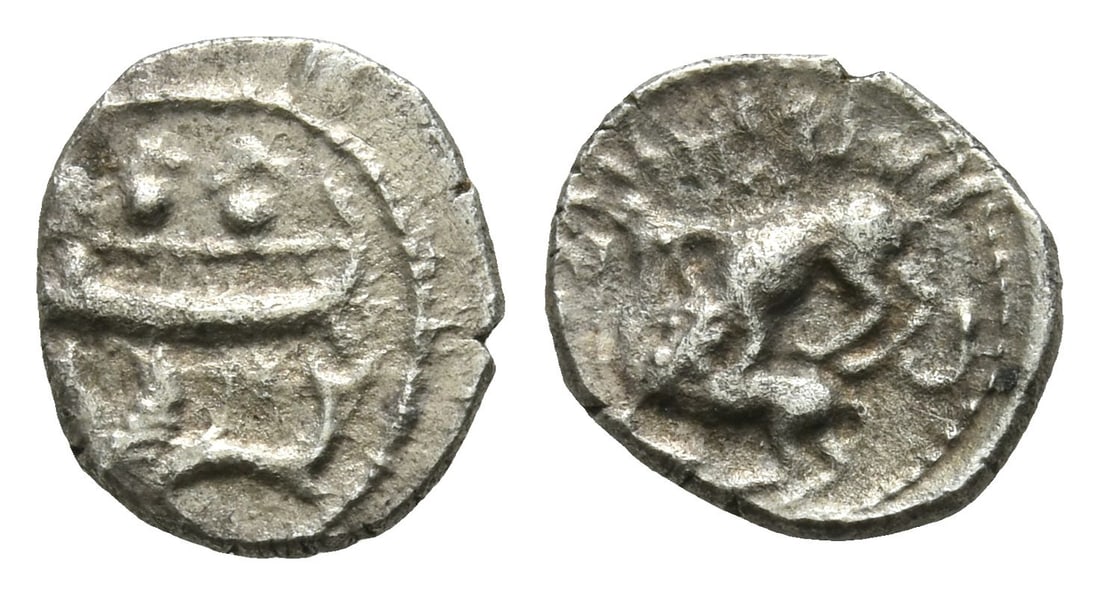 Phoenicia, Byblos AR 1/16 Shekel.: Second half of 4th century BC. Two hoplites holding shields standing in Phoenician pentekonter rowing to left; hippocamp to left below / Lion to left attacking bull to left. Cf. Betlyon 21 (Addirmilk