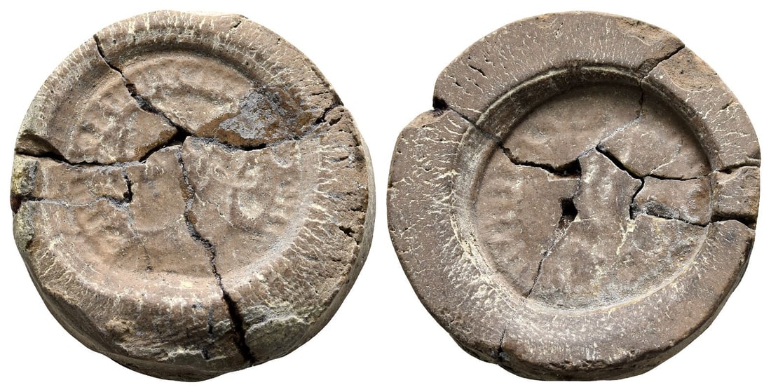 Roman Imperial, Terracotta Forger's Casting Mould.: 4th century AD. Laureate bust to right / Uncertain type. 4.48gr, 27mm. (1 1/8 in.). Condition as seen. From the collection of a gentleman, acquired on the London art market in the 1990s. With an impre