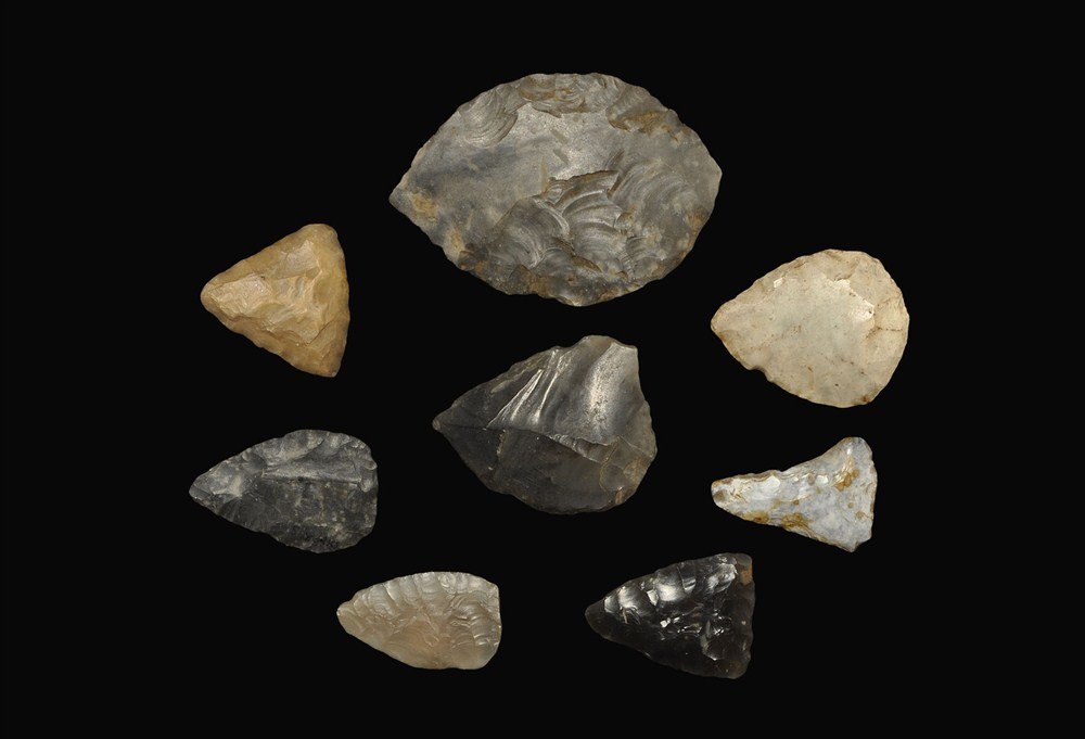 Stone Age Flint Arrowhead Collection: Mesolithic to Neolithic, 12000-1500 BC . A group of eight arrowheads comprising: a Mesolithic flint eccentric point on a thick flake (inked reference 'Beachy Head'); a Neolithic flint bifacial ovate l