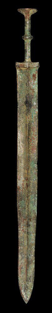 Chinese Bronze Sword with Discoid Pommel: Han Dynasty, 206 BC-220 AD . A cast short sword with slightly tapered blade, integral guard and hilt; the blade lozenge-section with median rib; rectangular guard with scooped upper edge; the grip col