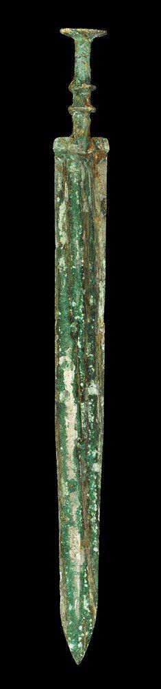 Chinese Bronze Sword with Discoid Pommel: Han Dynasty, 206 BC-220 AD . A cast short sword with slightly tapered blade, integral guard and hilt; the blade lozenge-section with median rib; rectangular guard with cast segmented pattern; the grip
