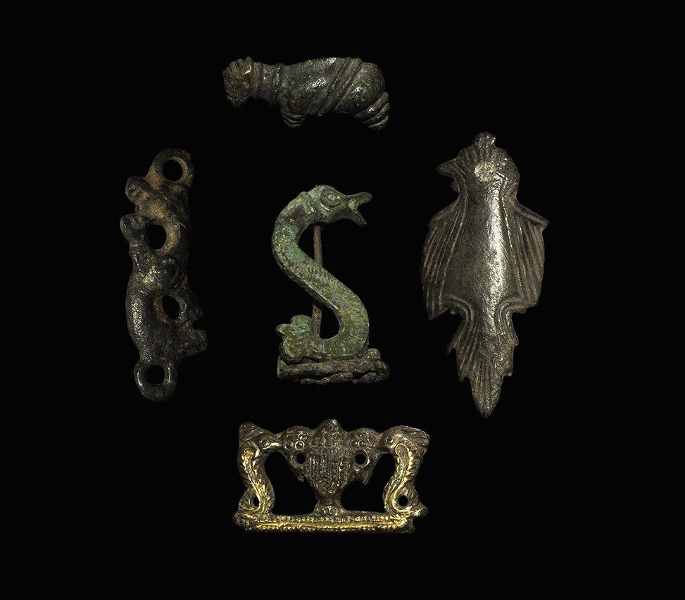 Roman Bronze Animal Brooch Group: 2nd century AD . A mixed group of plate brooches comprising: a bird in profile, incised linear detail to the wings and tail, enamel roundel to the eye, pin, pin-lugs and catchplate to the reverse; a l