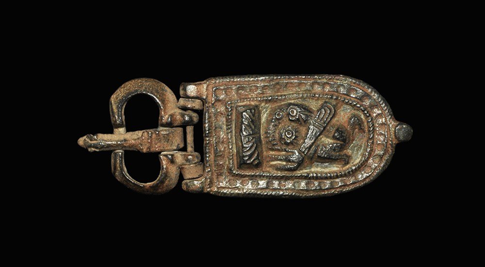 Byzantine Bronze Buckle with Plate: 6th-8th century AD . A cast buckle set comprising: a kidney-shaped loop with panel to the front, recess to the upper edge; a tongue in the shape of a serpent; a tongue-shaped plate with high-relief de