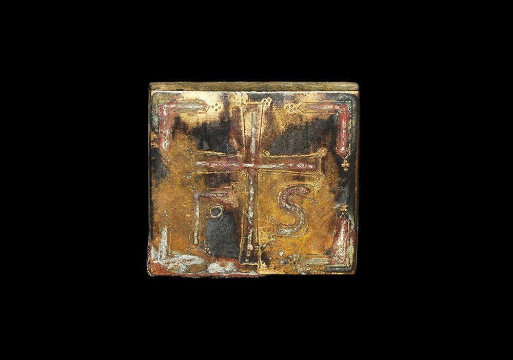 Byzantine Bronze Weight: 5th-6th century AD . A large cast weight, square in plan with incised design of a cross and four corner right-angles, gamma, a roundel and sigma, all with four punched-points to the angles. See Weber,
