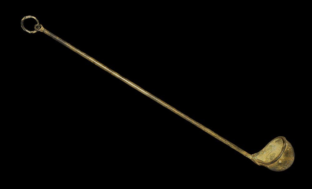 Byzantine Bronze Water Ladle: 6th-10th century AD . A cast ladle with bulbous bowl and rolled rim, round-section shaft, pierced finial and suspension ring. 177 grams, 43 cm (17"). Acquired on the London art market in the 1960s. [N