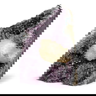Large Amethyst Geode with Calcite Formation: Cut geode lined with richly-coloured dark purple and lavender coloured amethyst crystals; to the centre of the geode, large cream-coloured calcite crystals bordered by green celadonite and white quart