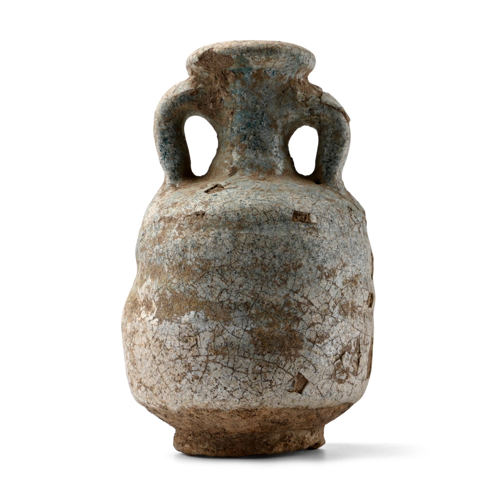 Lead-Glazed Ribbed Glass Amphora: Parthian, 3rd-1st century B.C. Squat in profile with ribbed sidewall and scooped foot, trumpet-shaped neck and mouth flanked by two thick loop handles. 104 grams, 95 mm (3 3/4 in.). [No Reserve] Ex Lo