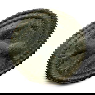 Anglo-Saxon Bronze Beast Facing Back Applied Brooch Face: 6th-8th century A.D. With two bands of beading to the border, low-relief repoussé image of a regardant beast in profile, small cross above the rump. Cf. West, S., A Corpus of Anglo-Saxon Finds From S
