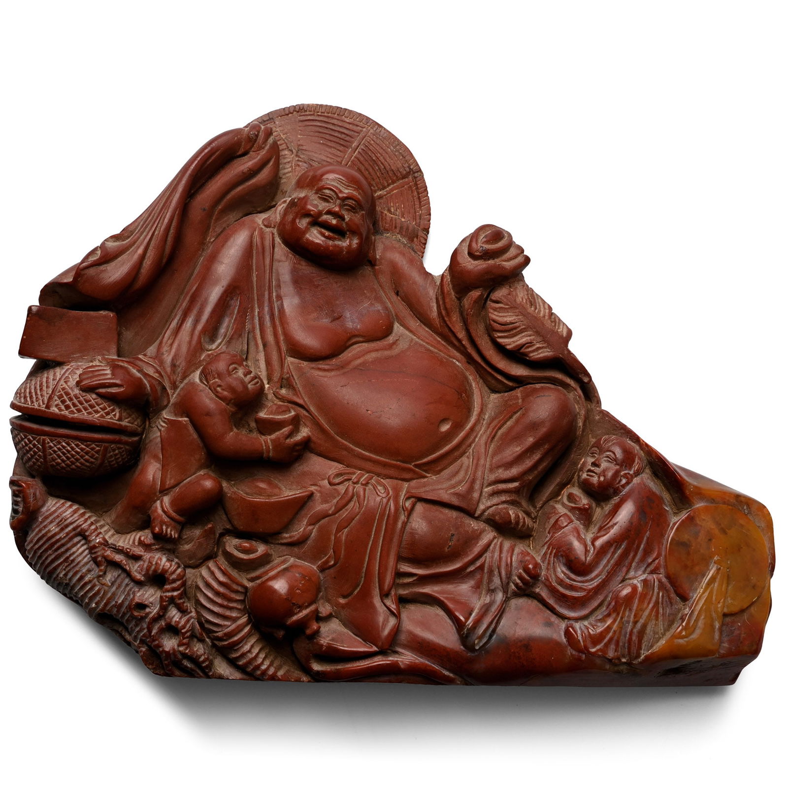 Jasper Buddha Carving: 19th-20th century A.D. Carved in the round frieze with Buddha reclining flanked by by attendants holding bowls, straw hat to the rear of his head, draped cloth and other items. 607 grams, 16 cm (6 1/4