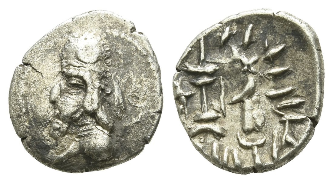 Kingdom of Persis. Darev (Darios) II AR Hemidrachm.: Kingdom of Persis. Darev (Darios) II AR Hemidrachm. 1st century BC. Diademed bust to left, wearing tiara with ear flap and decorated with crescent; monogram(?) behind / King standing to left, holding 