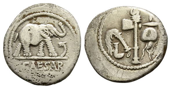 The Caesarians, Julius Caesar AR Denarius.: The Caesarians, Julius Caesar AR Denarius. April-August 49 BC. Military mint traveling with Caesar. CAESAR, elephant advancing to right, trampling on horned serpent / Emblems of the pontificate: simpu
