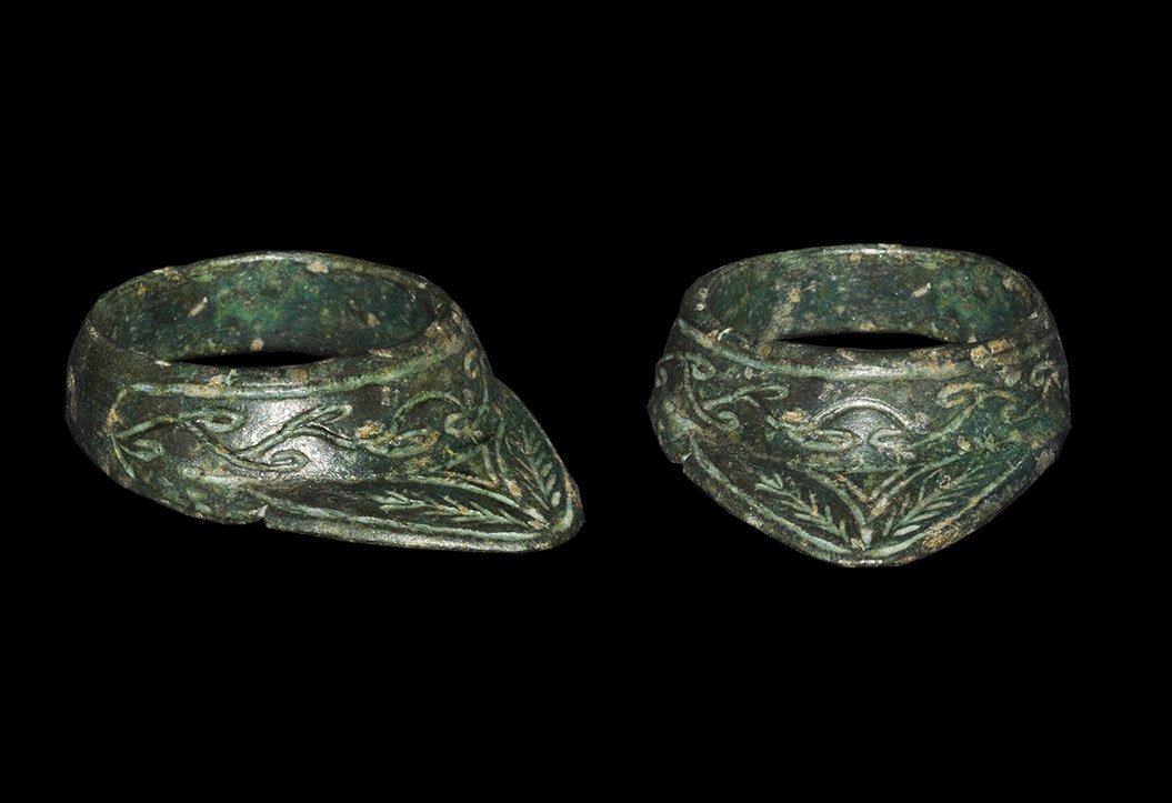 Byzantine Bronze Floral Decorated Archer's Ring: 10th-14th century AD. A cast thumb ring with triangular extension decorated with incised scrolled linear designs. Private collection, Buckinghamshire, UK; formed in the 1980s. Found East Anglia in 198