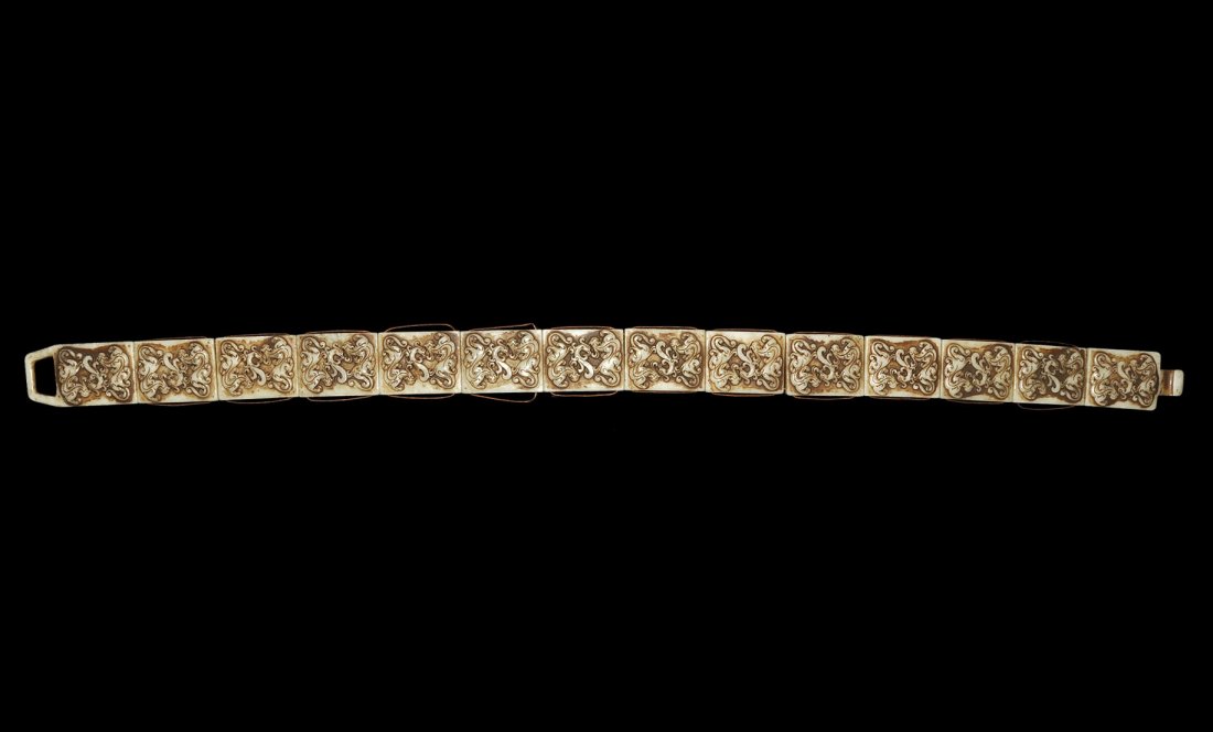 Chinese Style Bowenite Link Belt: A belt formed from linked carved Bowenite plaques with low-relief scrolled animal designs, one with hooked finial the other a trapezoidal void. Acquired on the London art market in the 1960s. 926 gram