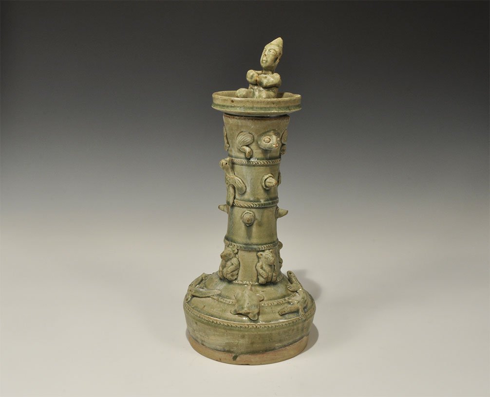 Cambodian Style Green-Glazed Ceramic Tower: An undated archaistic green-glazed model tower with flared bulbous base and recessed rim; to the sides of the tower, applied ropework bands and applied model birds, reptiles, turtles, and mice; in the
