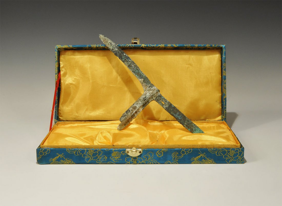 Chinese Style Bronze Halberd: An undated archaistic cast halberd with T-section attachment plate, spike to the rear with slot, elliptical-section blade to the forward side. Property of a London collector, acquired early 1960s. 159