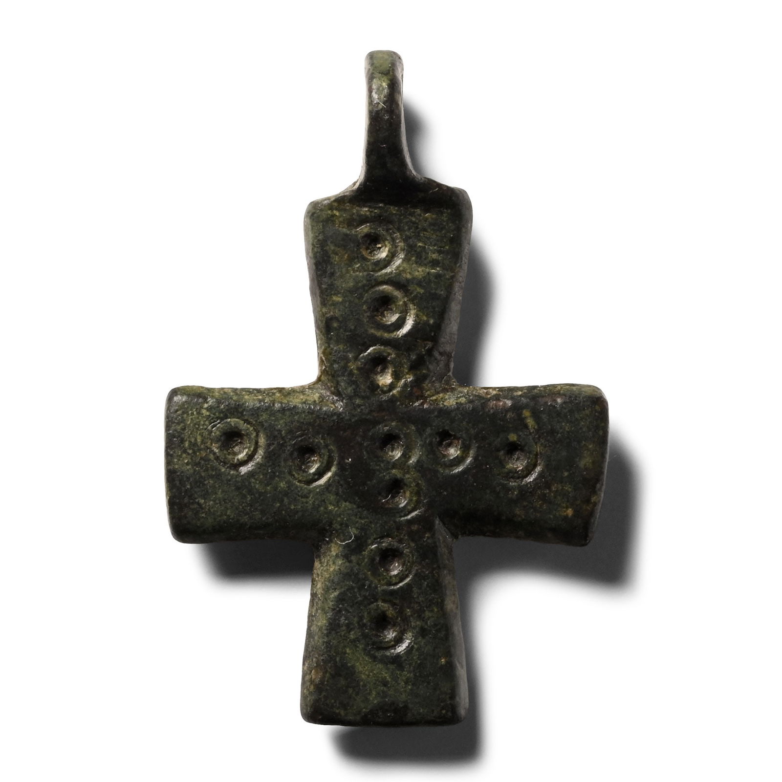 Byzantine Bronze Cross Pendant: 9th-12th century A.D. With slightly expanding arms and integral loop; band of impressed ring-and-dot motifs to obverse. 4.71 grams, 31 mm (1 1/4 in.). [No Reserve] Ex David Miller, Hemel Hempstead, Lo