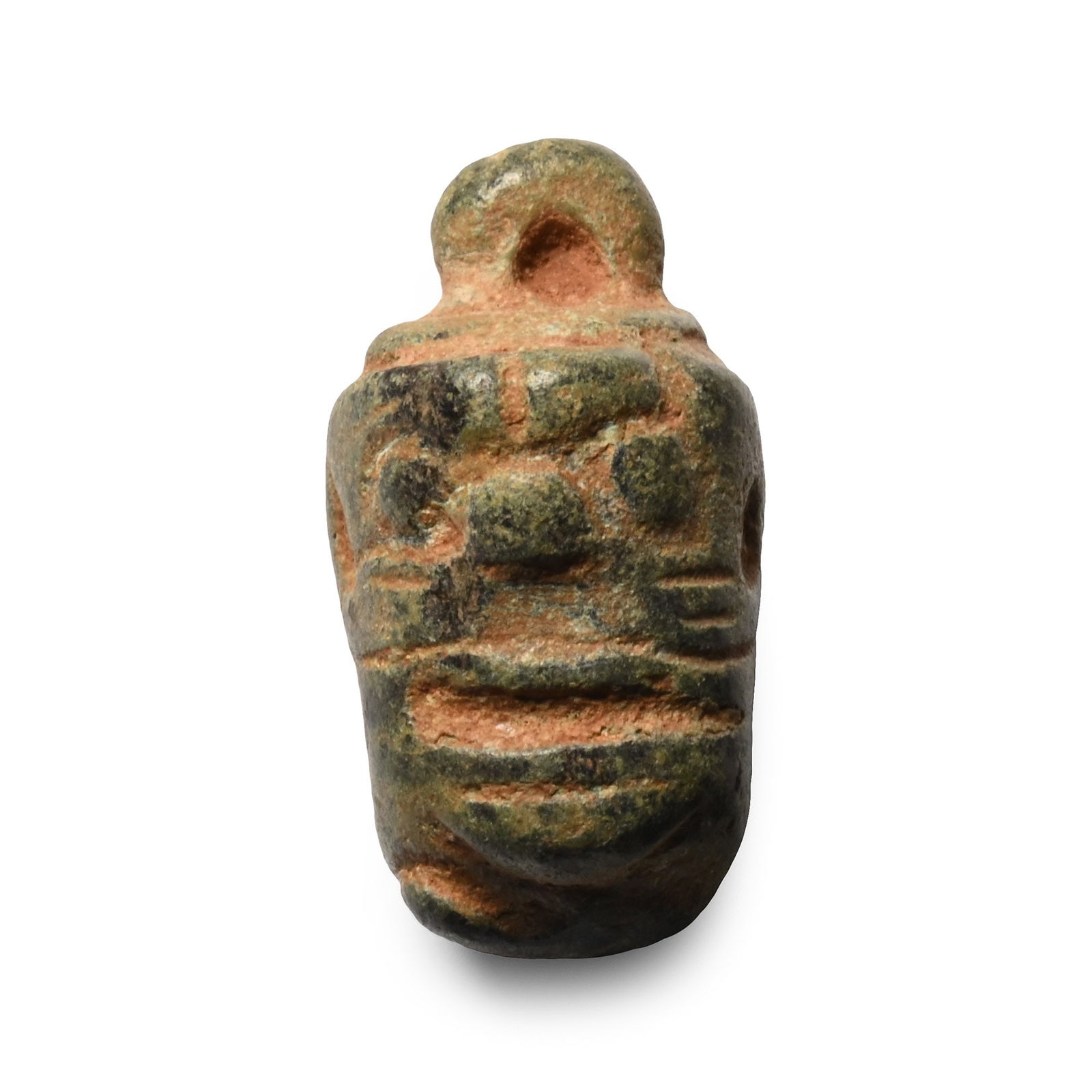 Babylonian Bronze Pazuzu Head Pendant: 1st millennium B.C. Drum-shaped with addorsed grotesque masks beneath a sturdy loop. 14 grams, 23.5 mm (7/8 in.). From a collection of a late London, UK, collector, 1980s. This lot has been cleared ag