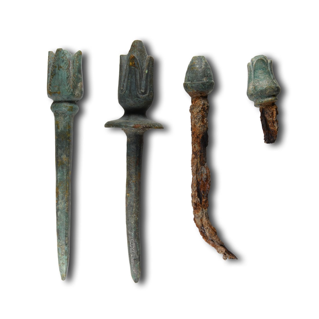 Achaemenid Bronze Flower Finial Collection: 6th-4th century B.C. Including two small buds with ferrous spikes and two larger blooms with square-section mounting pins. 687 grams total, 62-175 mm (2 1/2 - 6 3/4 in.). [4] Acquired on the European 
