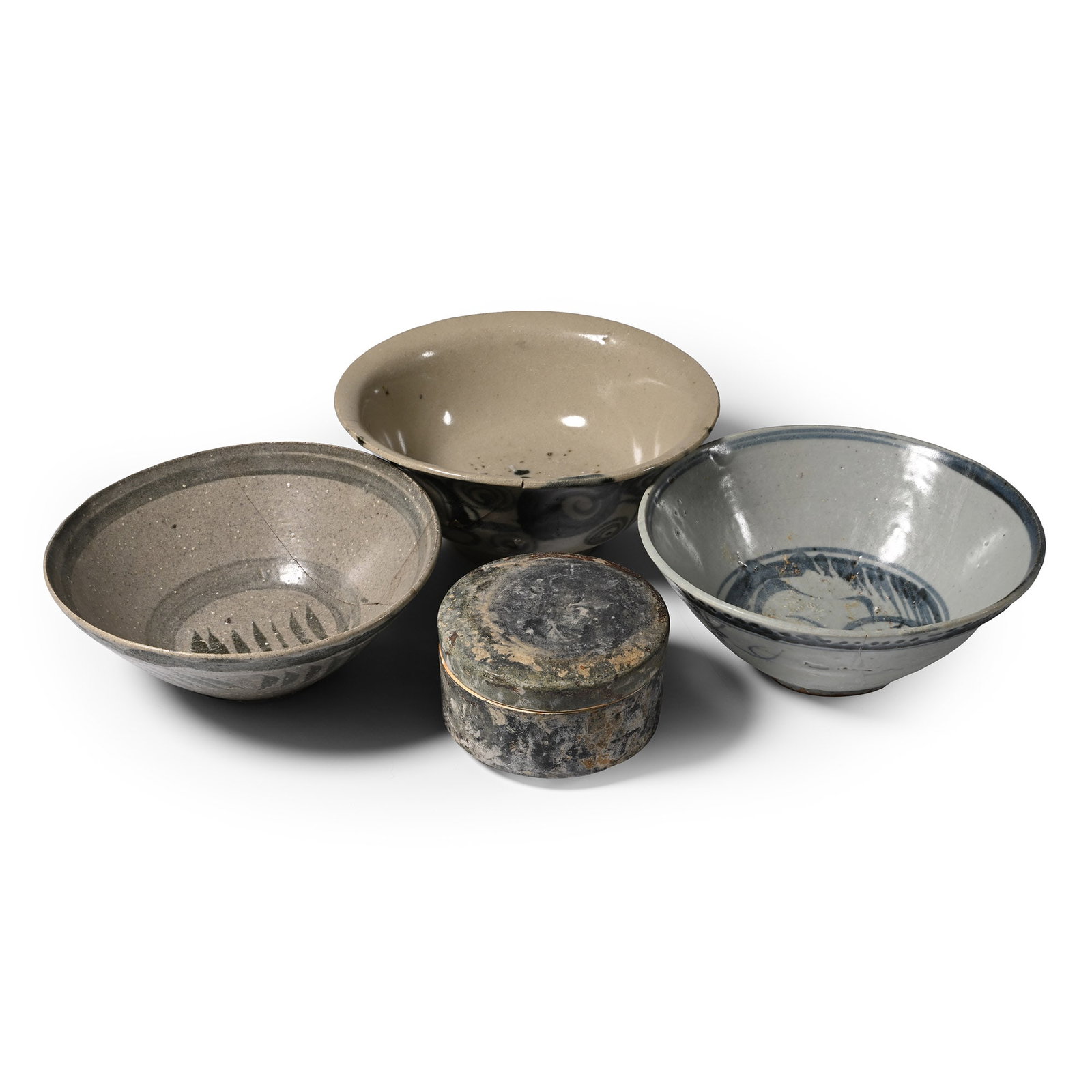 Tek Sing Treasure Shipwreck Glazed Bowl and Box Group: Early 19th century A.D. Comprising three bowls, one footed with scroll decoration to the outer face; one with tendrils to both faces and decorative border to the outer face; one with dashes and concen
