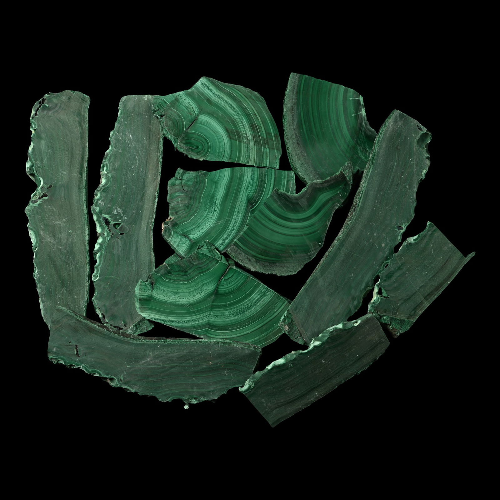 Green Malachite Cut Slice Section Group [10]: Comprising ten partially polished slices showing banding and 'eye' formations. 547 grams total, 6.9-12.4 cm (2 3/4 - 4 7/8 in.). [10, No Reserve] From Democratic Republic of the Congo, Central Africa.