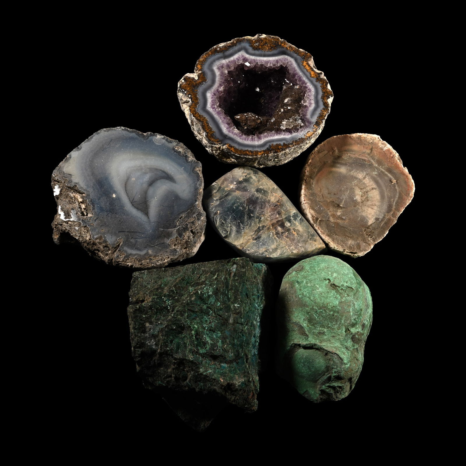 Large Mixed Mineral and Crystal Display Piece Collection [6]: Comprising: two cut agate geode halves, one lined with amethyst crystals; malachite, petrified wood section, and fluorite. 3.47 kg total, 8.6-10.2 cm (3 3/8 - 4 in.). [6, No Reserve] Ex Mineral Import