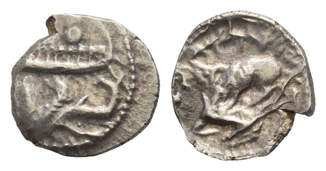 Phoenicia. Byblos AR 1/16 Shekel.: 4th century BC. Galley to left, containing two hoplites with helmets and round shields; hippocamp to left below / Lion attacking bull to left. Cf. HGC 10, 139. 0.80gr, 10mm, 10h. (For this specific lo