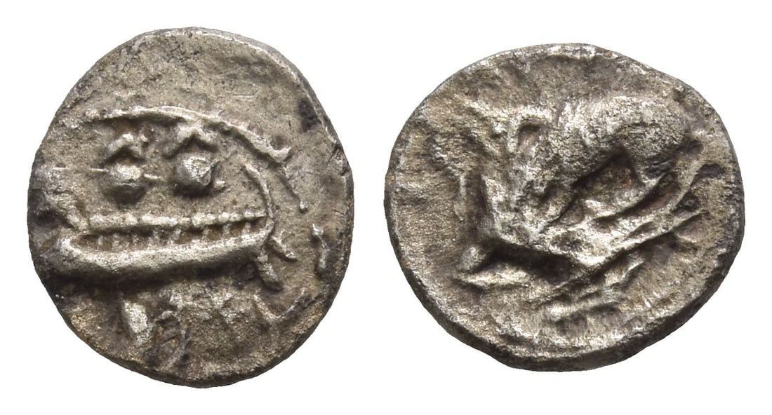 Phoenicia. Byblos AR 1/16 Shekel.: 4th century BC. Galley to left, containing two hoplites with helmets and round shields; hippocamp to left below / Lion attacking bull to left. Cf. HGC 10, 139. 0.70gr, 10mm, 10h. (For this specific lo