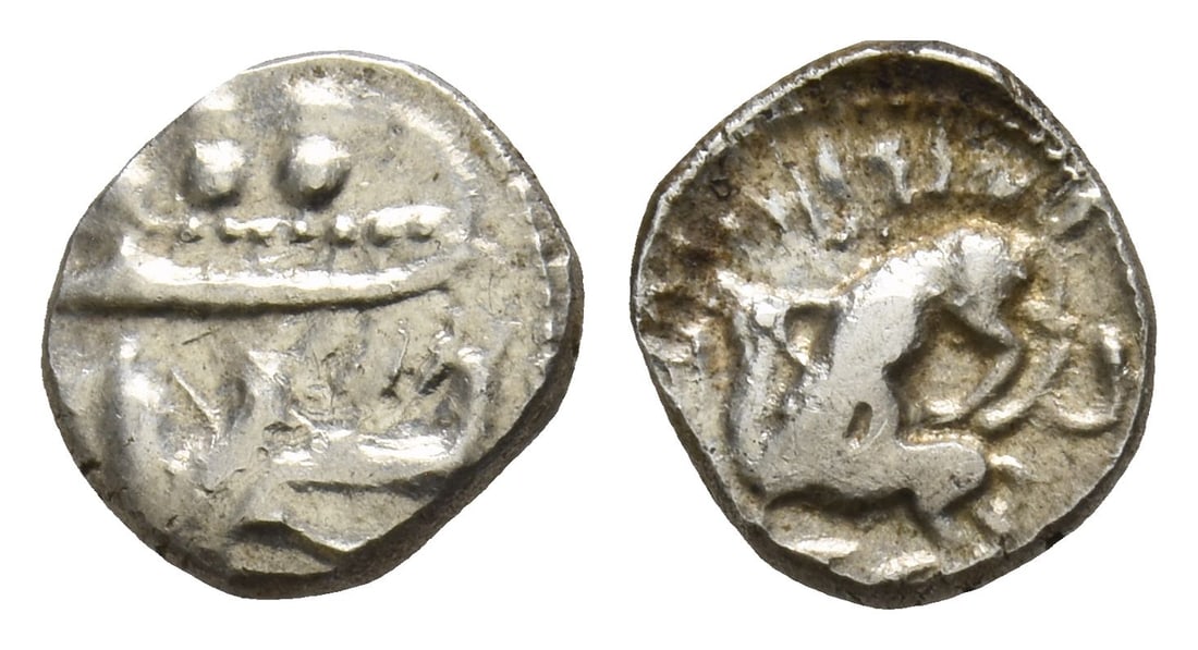 Phoenicia, Byblos AR 1/16 Shekel.: 4th century BC. Two hoplites, holding shields, on galley to left, prow ending in lion's head; below, hippocamp to left / Lion attacking bull to left. Cf. HGC 10, 137. 0.91gr, 10mm, 12h. (For this spec