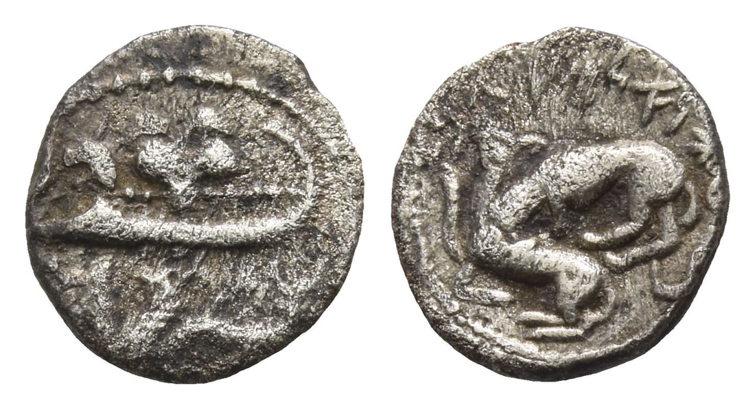 Phoenicia. Byblos AR 1/16 Shekel.: 4th century BC. Galley to left, containing two hoplites with helmets and round shields; hippocamp to left below / Lion attacking bull to left. Cf. HGC 10, 139. 0.68gr, 10mm, 12h. (For this specific lo