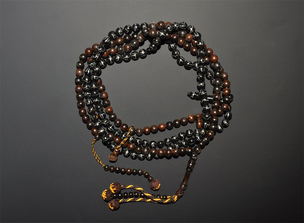 Islamic Glass Prayer Bead Necklace Group: A prayer strands group comprising: islamic beads resembling black coral or horn with hammered silver dots including a baluster bead, and another in dark brown wood or bone, including a baluster bead, 