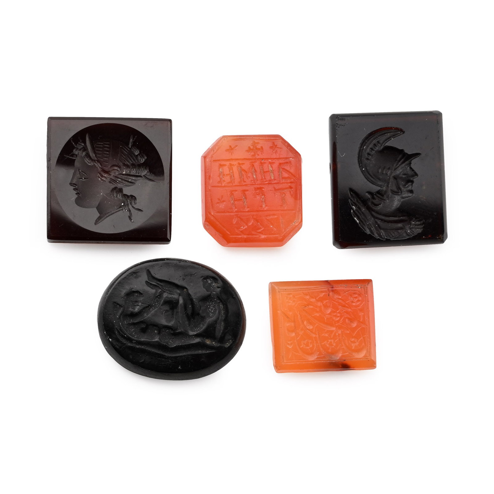 Post-Classical Stone Gemstone Collection: 20th century A.D. Including rectangular and ellipsoidtypes with incuse profile bust and other motifs. 13.2 grams total, 15-21 mm (5/8 - 7/8 in.). [5, No Reserve] Private collection, England. TimeLine
