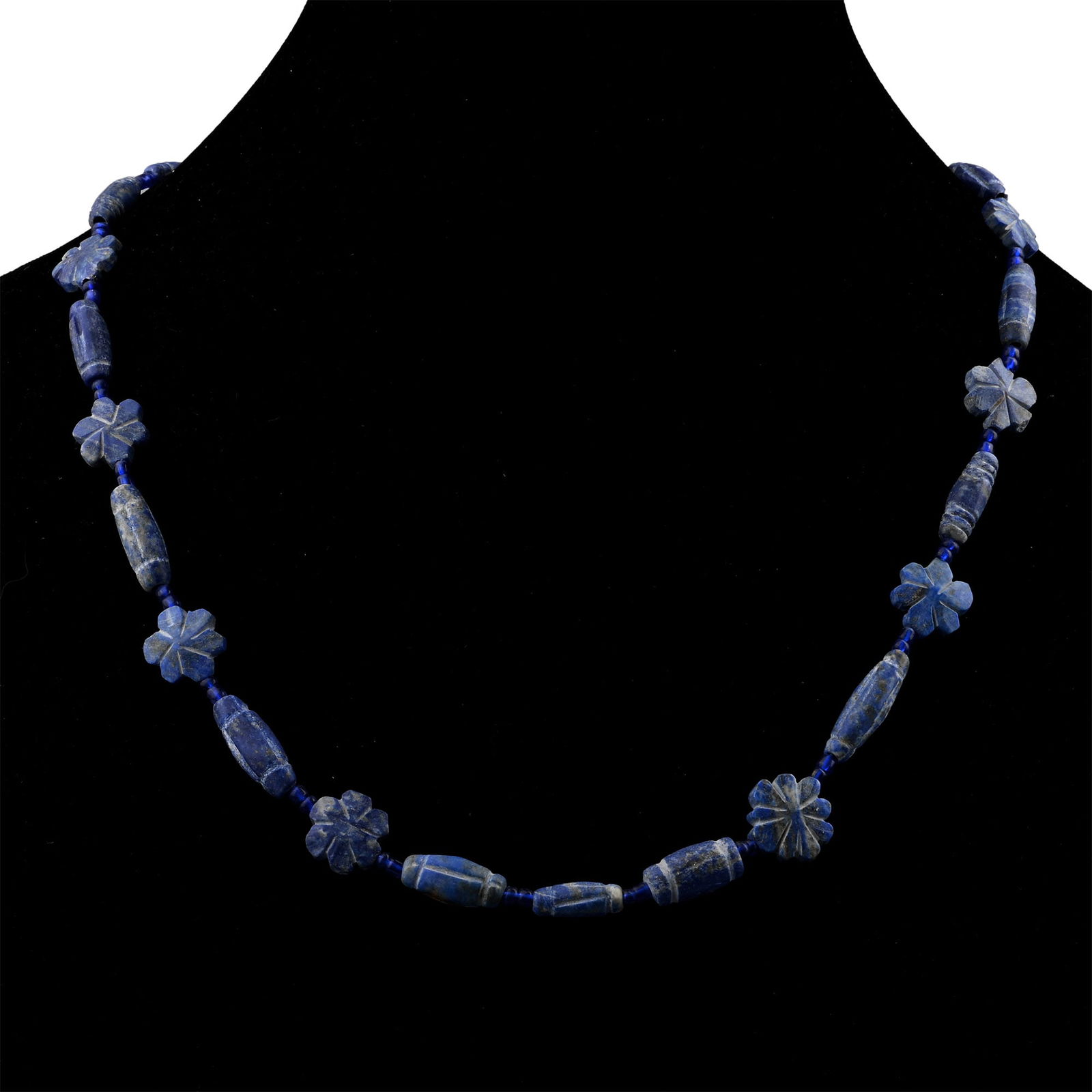 Bactrian Style Lapis Lazuli and Other Bead Necklace String: 20th century A.D. Restrung group of fusiform and other types with interstitial rosettes. 29.9 grams, 44.5 cm (17 1/2 in.). [No Reserve] From London, UK, gallery collection, 1990s. TimeLine Auctions fo