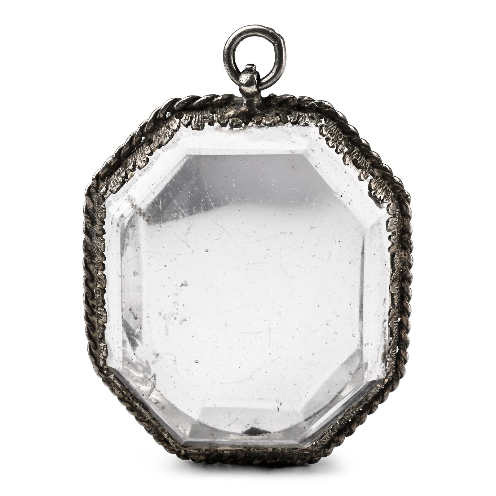 Post Medieval Silver-Mounted Glass Pendant: Germany, 17th century A.D. Octagonal in plan with ropework and foliage frame, suspension loop. 52.2 grams, 65 mm (2 1/2 in.). Private collection, Europe. Acquired on the English art market. TimeLine A