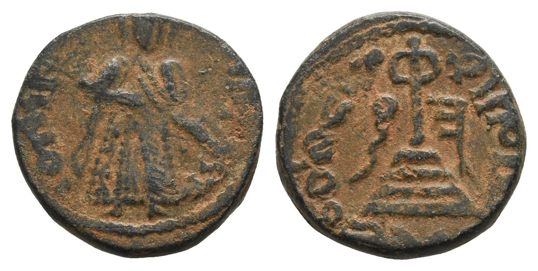 Umayyad Caliphate AE Fals.: Time of 'Abd al-Malik ibn Marwan, AH 65-86 (AD 685-705). Sarm?n mint. Arab-Byzantine type: Standing Caliph. Caliph standing facing, placing his right hand on the hilt of his sword, whip shown as long