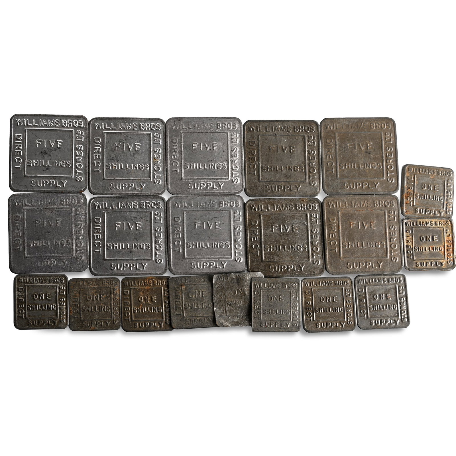 England. Group of Twenty One [21] Williams Bros. Five and One Shilling Tin Tokens.: 20th century AD. Comprising: various denominations of Williams Bros. Stores Ltd tokens. 51gr total. Condition as seen. From the private collection of John Meredith, acquired since the 1990s; thence by