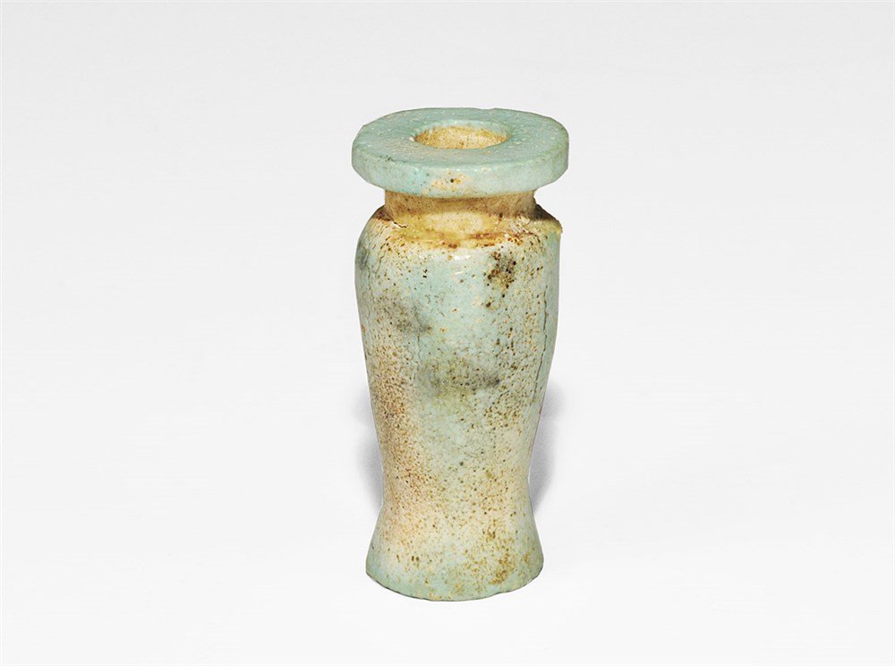 Egyptian Glazed Composition Miniature Pot: Ptolemaic Period, 332-30 BC. A blue and white glazed composition miniature pot with piriform body, flat base and flange rim. 13 grams, 45 mm (1 3/4"). UK art market, acquired prior to 1980.