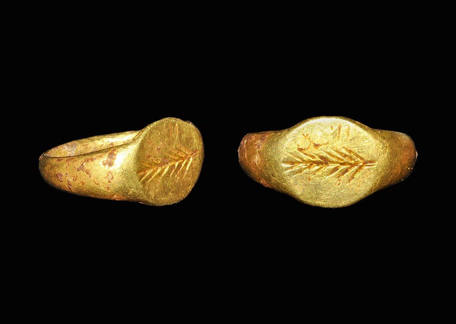 Roman Gold Finger Ring with Palm Branch: 3rd-4th century AD. A D-section hoop expanding to an elliptical bezel with intaglio palm-branch motif. 1.89 grams, 13 mm overall, 10.78 mm internal diameter (1/2"). From a Swiss collection.