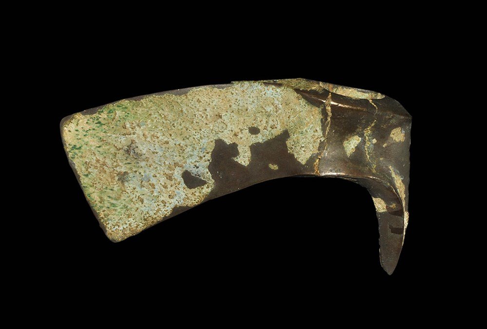 Near Eastern Luristan Bronze Axehead: Bronze Age, 1250-650 BC. A cast axehead with scooped socket and triangular extension to the rear; the blade gently curved with straight edge. 230 grams, 11 cm (4 1/4"). From a Kent collection. [No Res