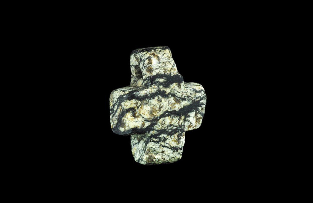 Byzantine Stone Cross Pendant: 5th-9th century AD. A carved equal-armed cross pendant with transverse hole to one arm. 11 grams, 29 mm (1"). Property of a European gentleman living in London; acquired in the UK before 1980. [No Res
