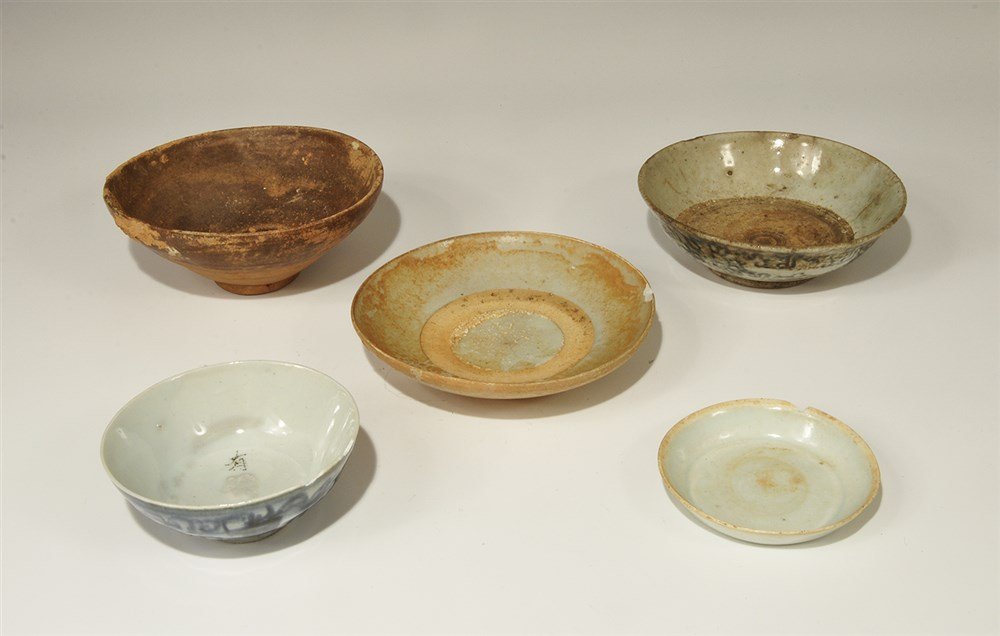 Chinese Ceramic Glazed Bowl Group: Ming Dynasty, 1368-1644 AD. A mixed group of ceramic bowls comprising:one terracotta, brown glaze, pedestal foot; one tin-glazed, blue rosettes to the outer face; one shallow, part-glazed; one deep, t