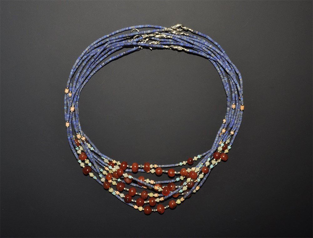 Afghanistan Lapis, Carnelian, Turquoise and White Metal: A group of undated archaistic necklaces from Afghanistan orPakistan, each comprising spherical cornelian, cylindrical lapis and white metal beads, with modern clasps 61 grams total, 44 cm (17 1/4"). P
