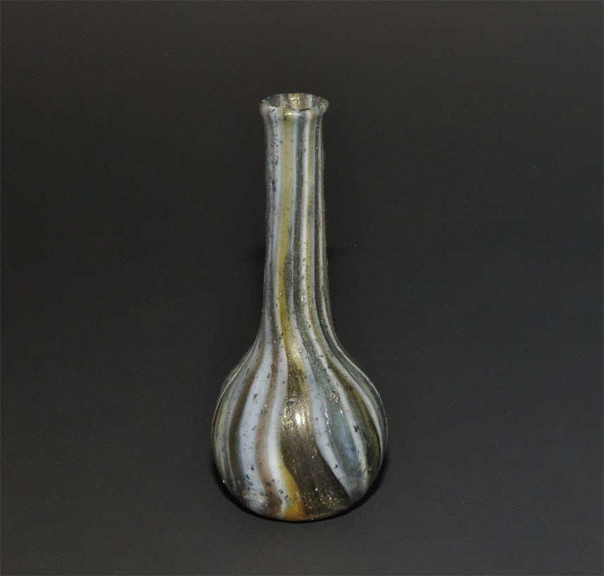 Venetian Style Marbled Glass Vessel: An undated archaistic globular glass vessel with tubular neck and everted rim; the glass white streaked with blue, black and yellow. 15 grams, 70 mm (2 3/4"). From an old London collection, formed in 