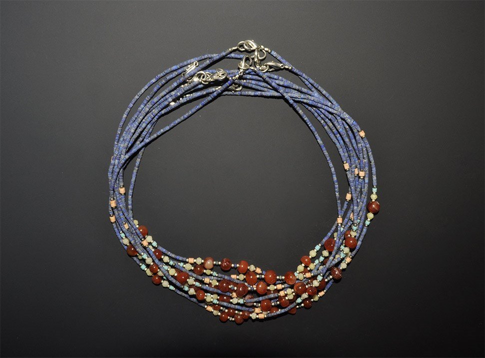 Afghanistan Lapis, Carnelian, Turquoise and White Metal: A group of undated necklaces from Afghanistan or Pakistan each comprised of short cylindrical lapis lazuli beads, with Carnelian, Turquoise and white metal beads, hand made clasps. 73 grams total, 43 