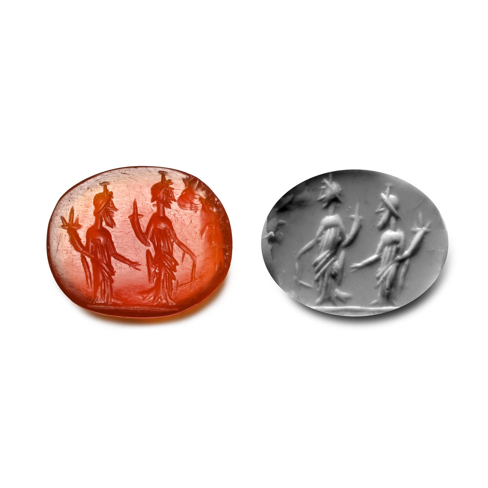 Roman Carnelian Gemstone with Fortuna and Abundantia: 2nd-3rd century A.D. With intaglio scene of two figures, each standing with a cornucopia, possibly Fortuna and Abundantia; supplied with a museum-quality impression. 0.60 grams, 12.90 mm (1/2 in.). [N