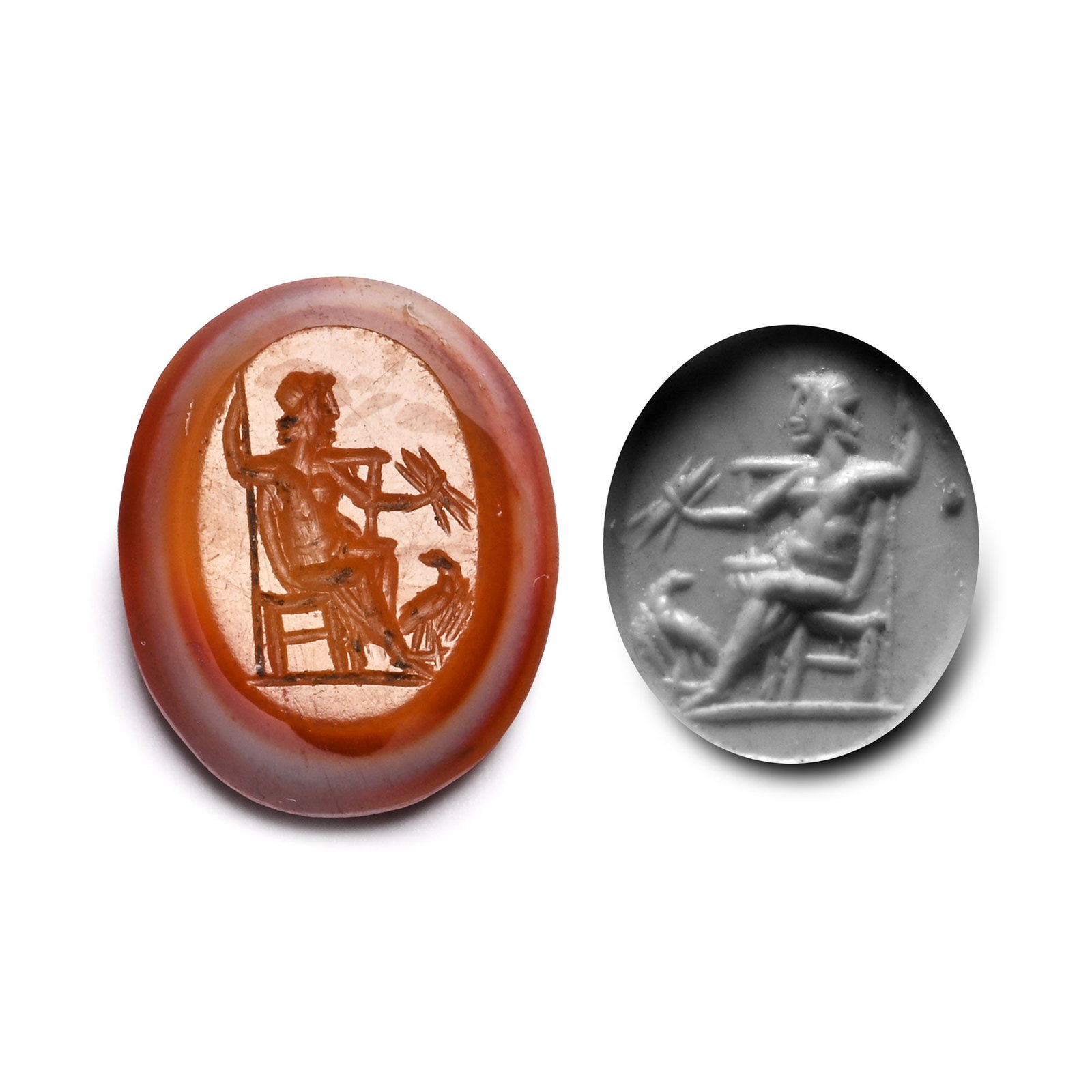 Roman Banded Agate Gemstone with Jupiter Seated: 2nd-3rd century A.D. With intaglio Jupiter sitting on his throne with a spear in one hand and an eagle at his feet; supplied with a museum-quality impression. 1.41 grams, 15.2 mm (5/8 in.). [No Reserv