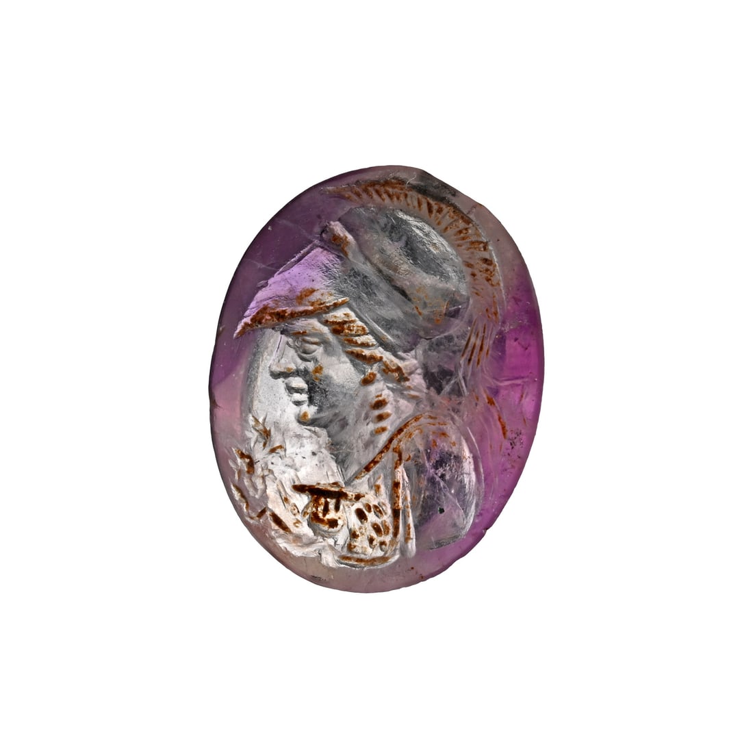 Roman Amethyst Gemstone of the Goddess Minerva: 1st-2nd century A.D. Plano-convex in section with incuse bust of Minerva wearing a Corinthian-style crested helmet; supplied with a museum-quality impression. 0.48 grams, 11 mm (3/8 in.). Private Engl