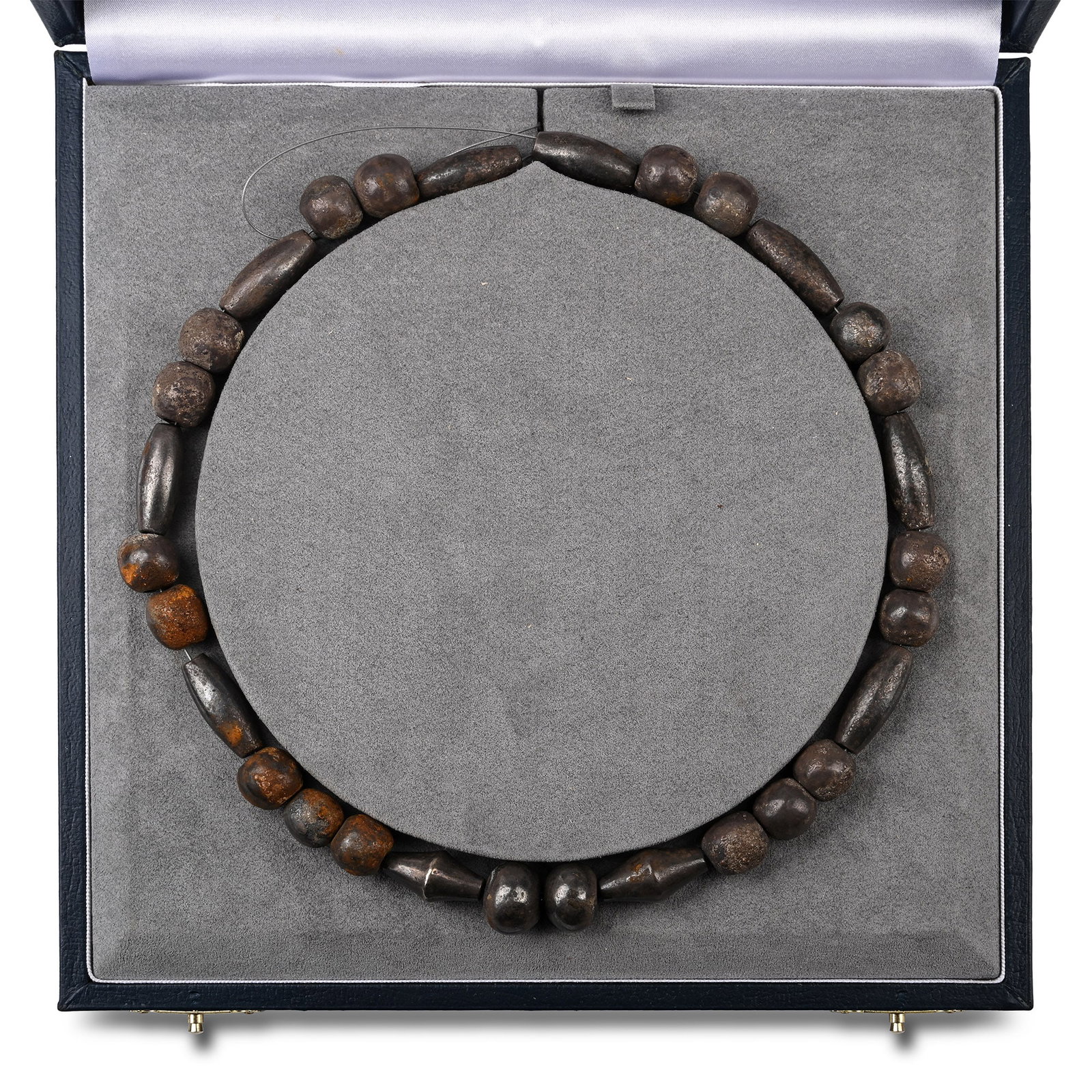 Mesopotamian Heavy Silver Bead Necklace: 3rd-early 2nd millennium B.C. Restrung and comprising mainly spherical, elongated ovals, oblates, and biconical shapes; accompanied by a custom-made lined display box. Cf. Bass, G.F. ‘A Hoard of Tro