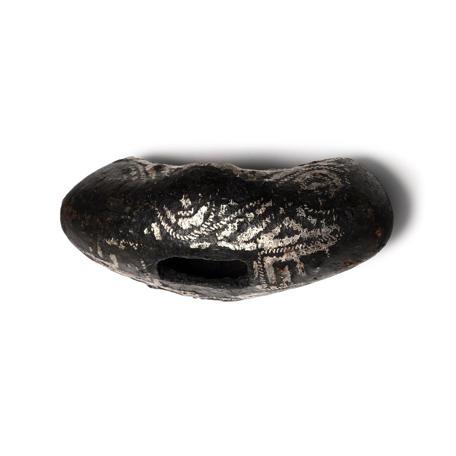 Scandinavian Viking Age Silver Inlaid Iron Hilt Guard: Circa 10th-11th century A.D. Hollow-formed with a deep curved profile; rectangular slot in the upper face for the tang; bands of applied silver ropework ornament on a sheet-silver field. Cf. Peirce, I