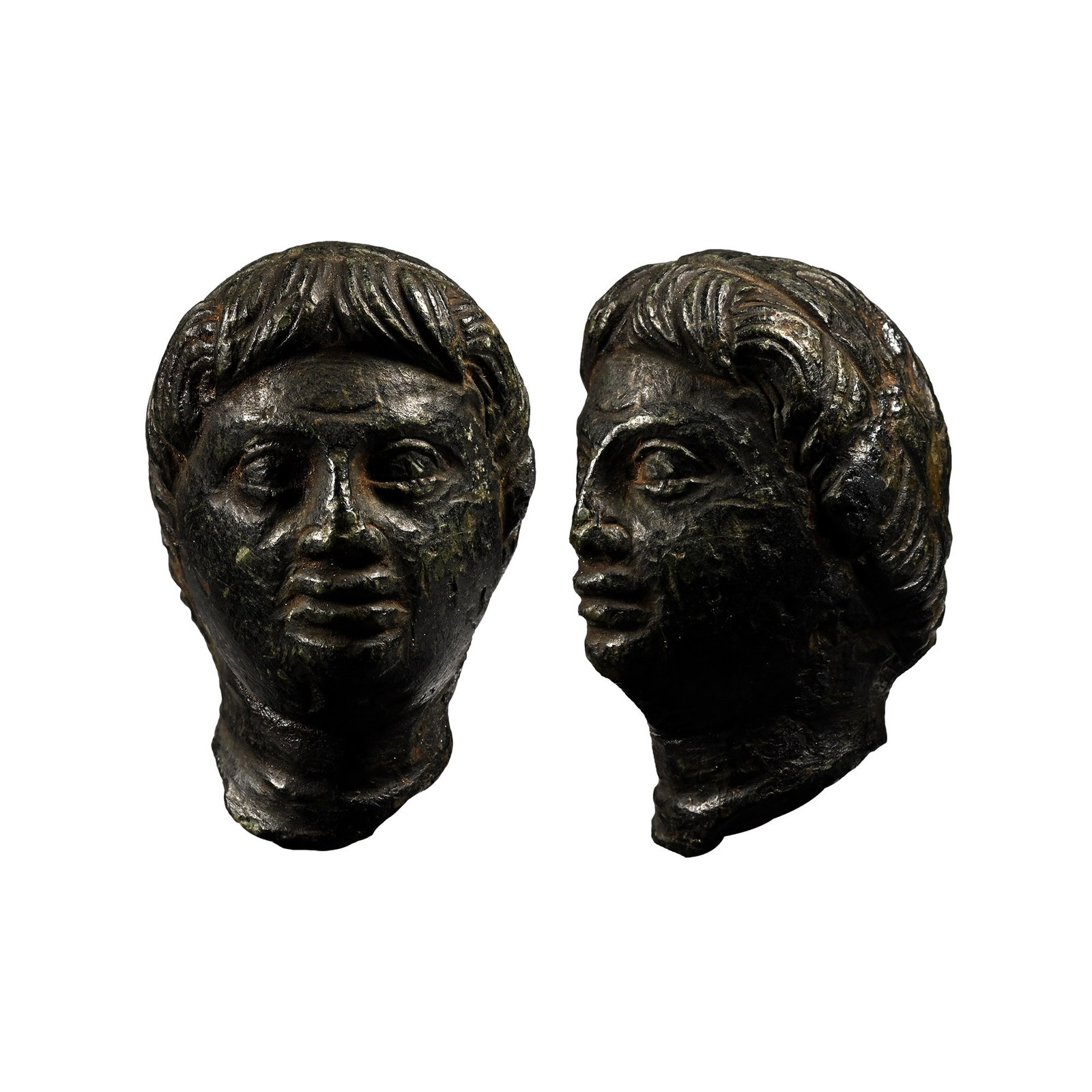Egyptian Steatite Portrait of a Ptolemaic Prince: 2nd-1st century B.C. With a round face, large eyes, a narrow nose that broadens at the end, and full lips downturned at the corners; the forehead with a distinctive deep furrow above the brow; a narro