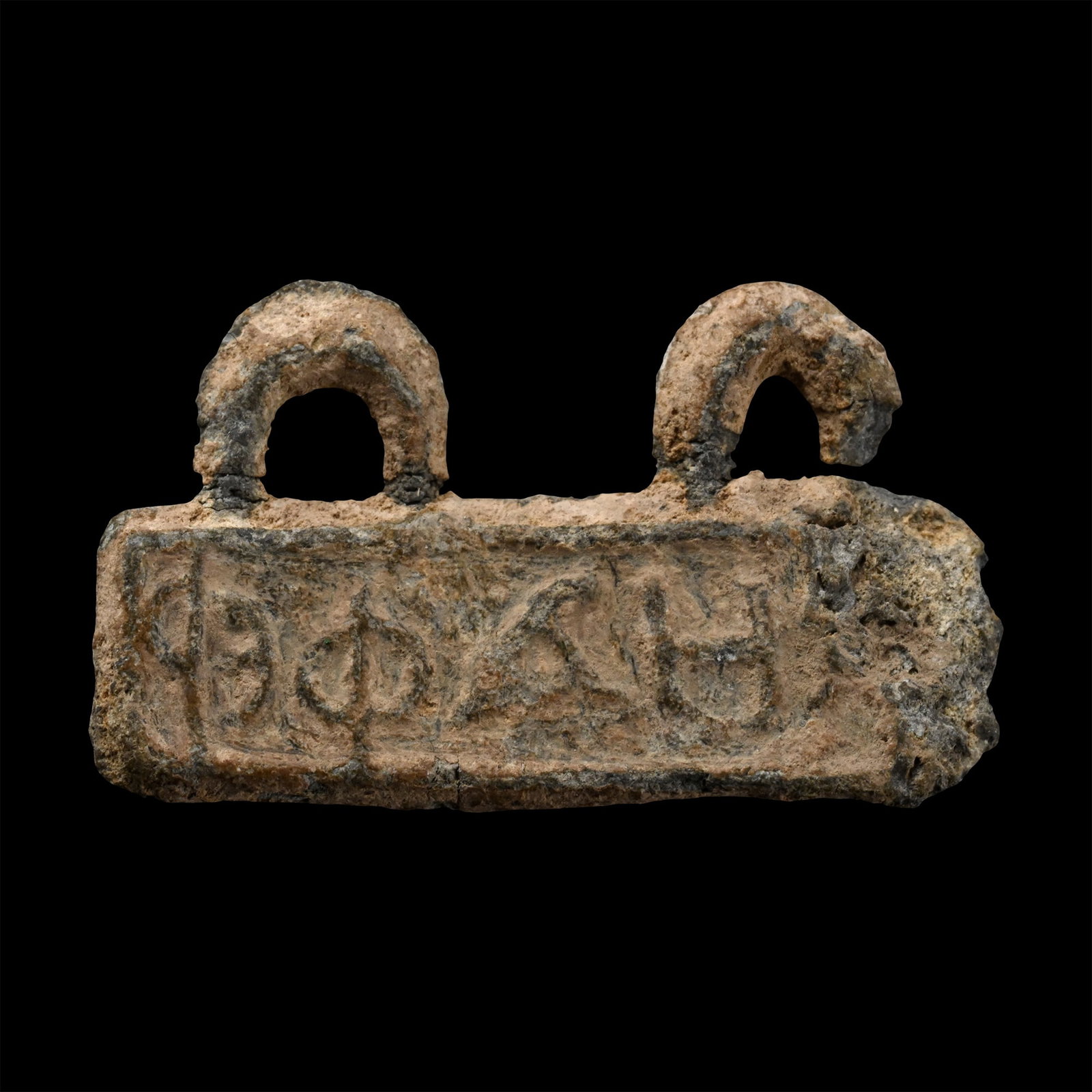 Greek Inscribed Lead Amulet: 2nd-1st century B.C. Rectangular in plan with two attachment loops to the upper edge, reserved enigmatic Greek legend '[.]???EP[.] / ?HIBBY'. 4.47 grams, 27 mm (1 in.). [No Reserve] From the collectio
